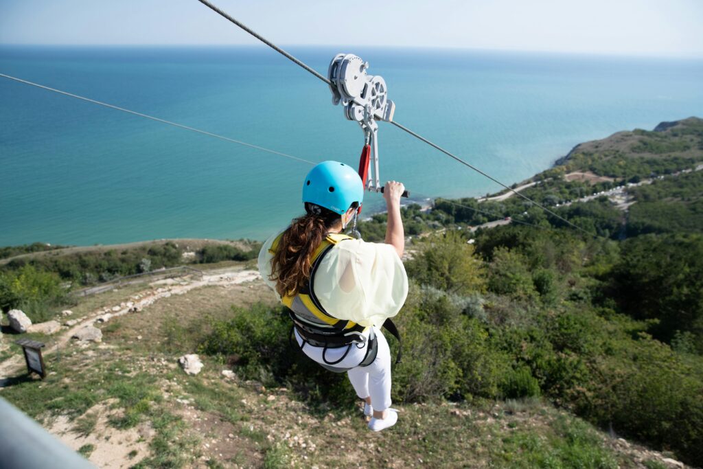 Experience the thrill of ziplining over a scenic Bulgarian landscape with breathtaking sea views.